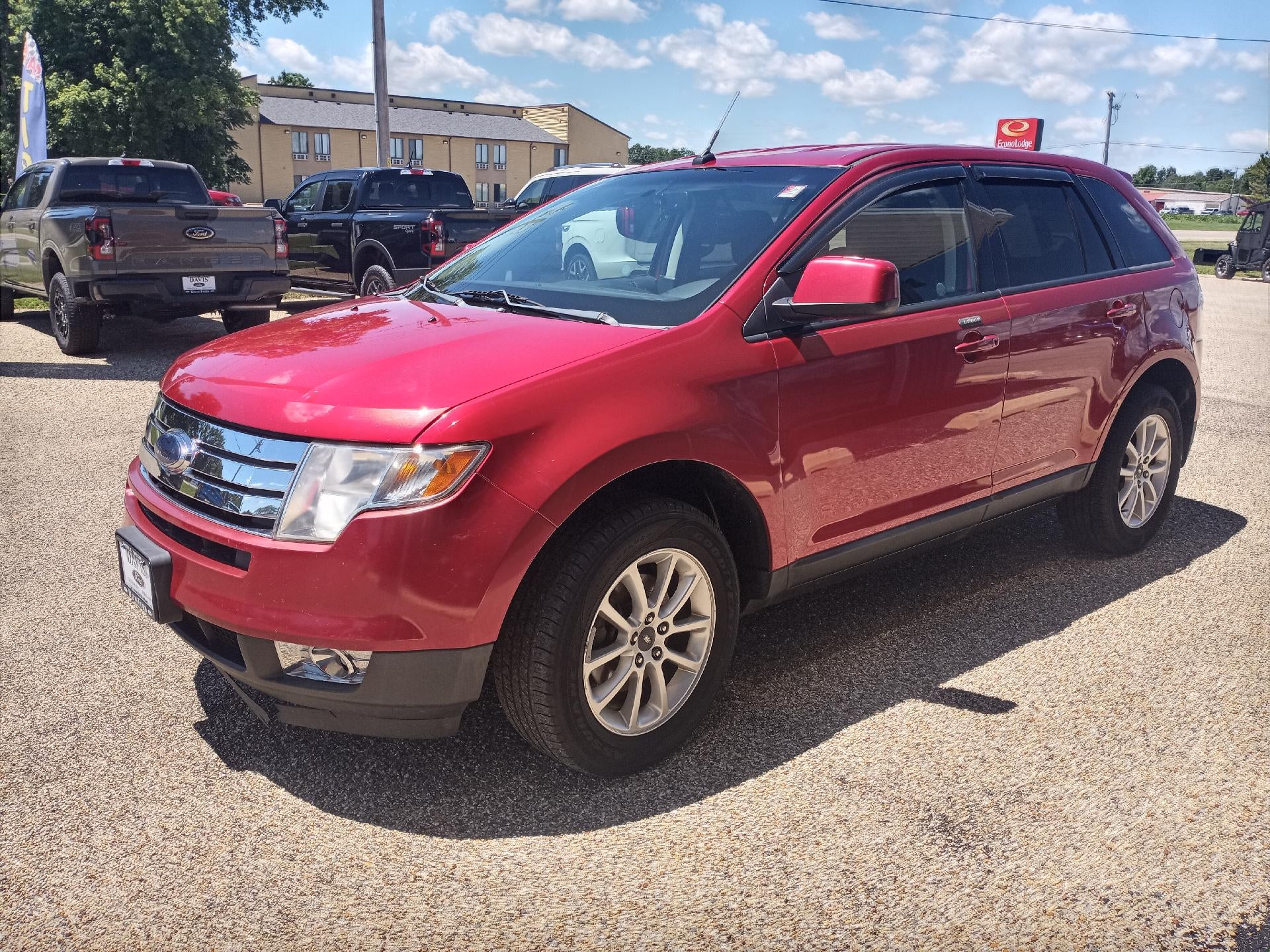 2010 Ford Edge 4dr SEL FWD in Red Candy Metallic Tint — front three-quarter view